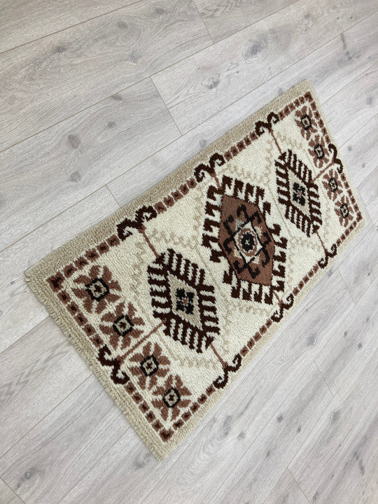 Beige/brunt orientalsk teppe