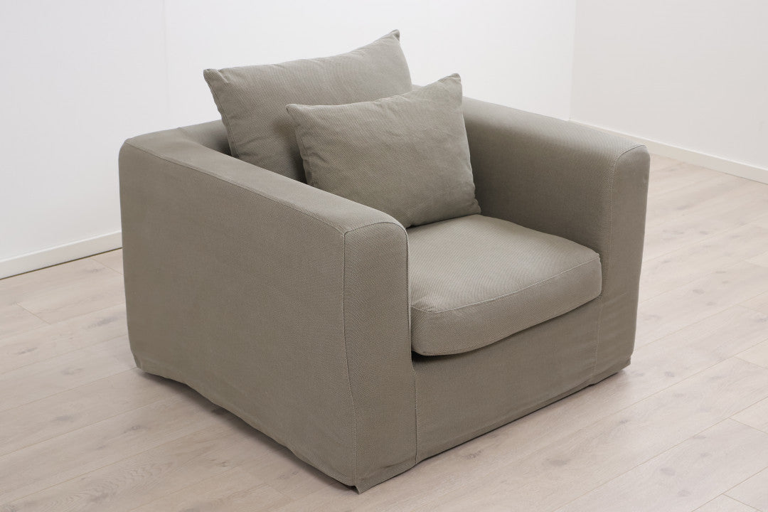 Nyrenset | Grønn lenestol med dunputer