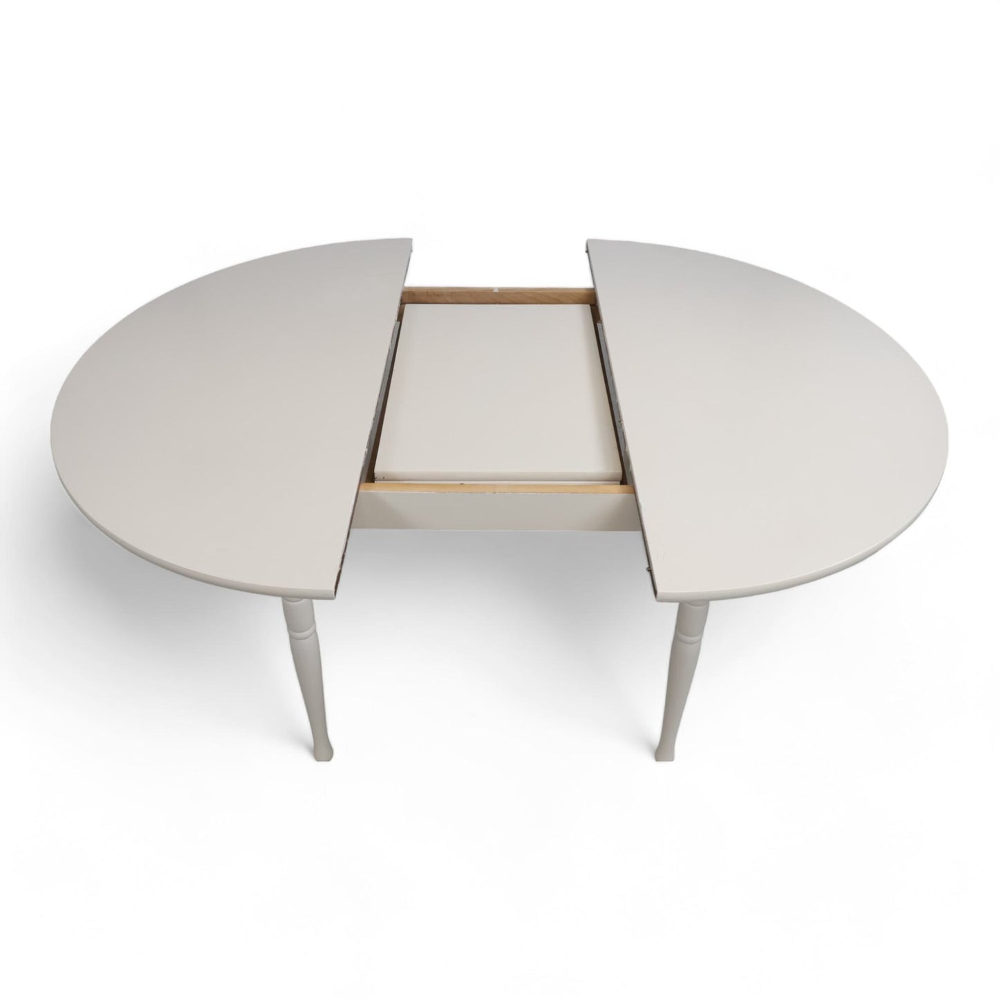 Hvitt rundt spisebord i tre med ileggsplate ø1120cm