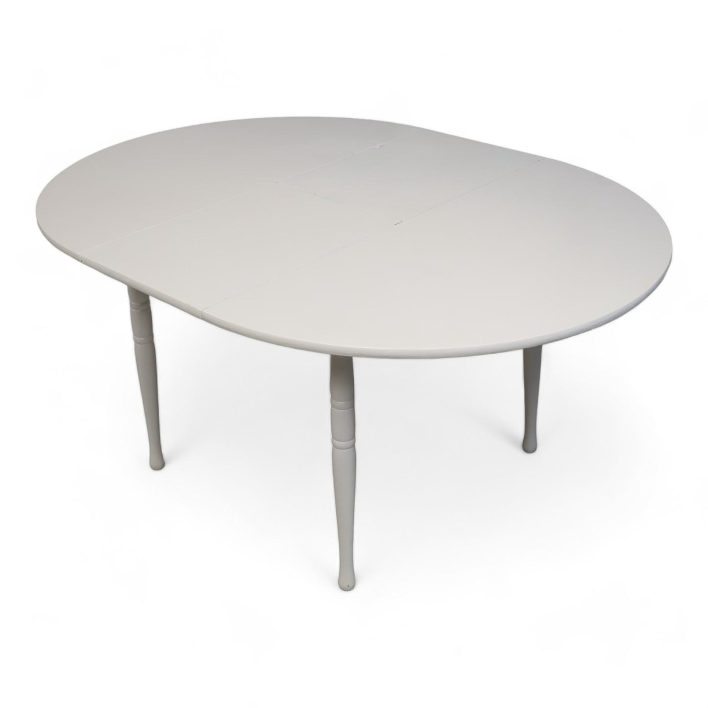Hvitt rundt spisebord i tre med ileggsplate ø1120cm