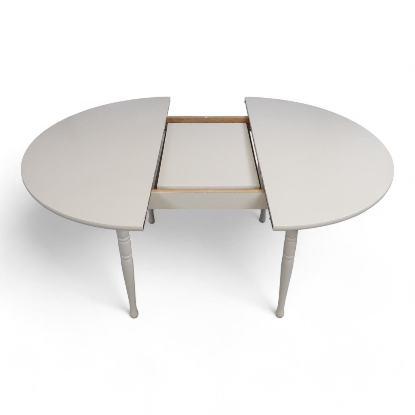 Hvitt rundt spisebord i tre med ileggsplate ø1120cm