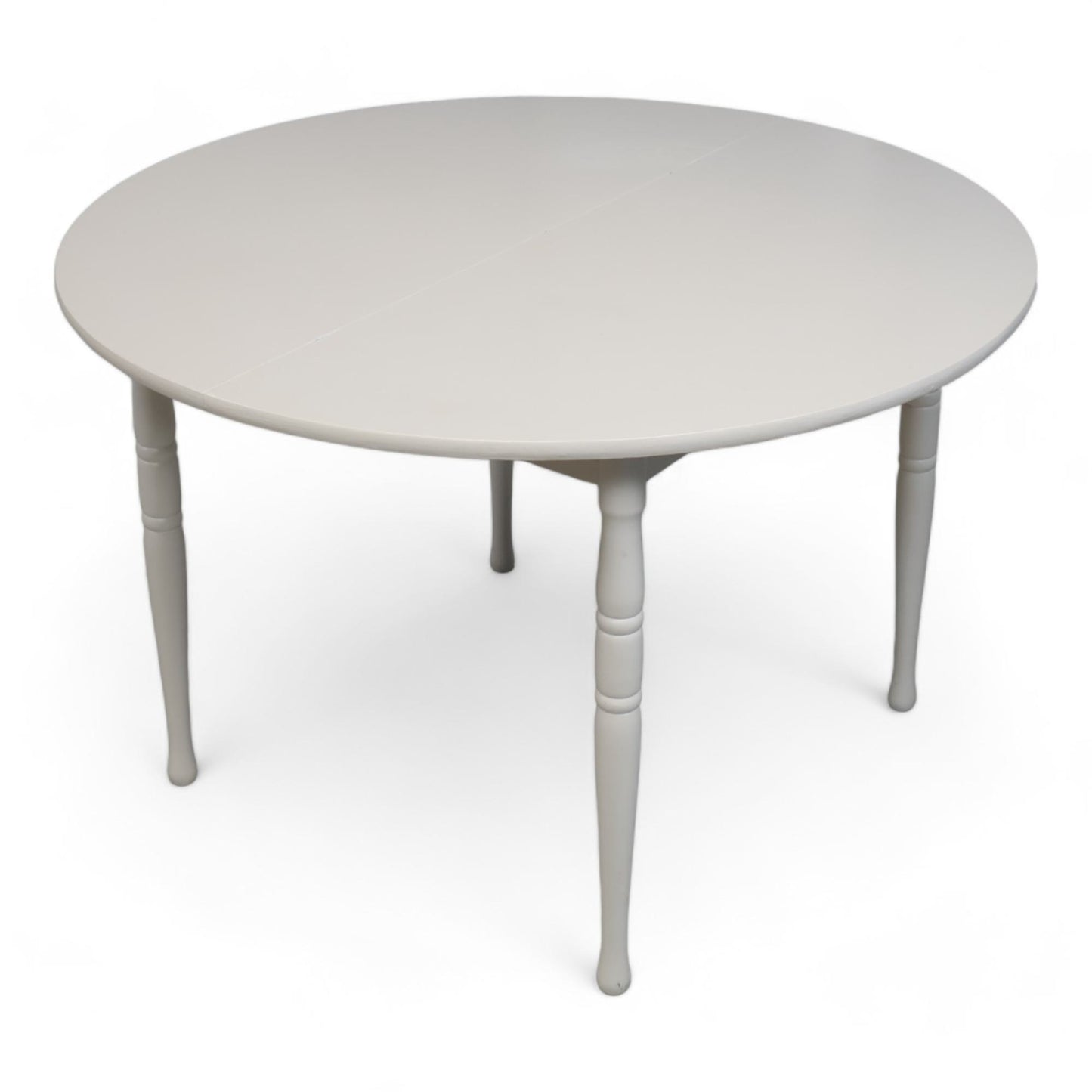 Hvitt rundt spisebord i tre med ileggsplate ø1120cm