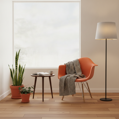 Eames Gyngestol fra Vitra i oransje, skallsete med meder